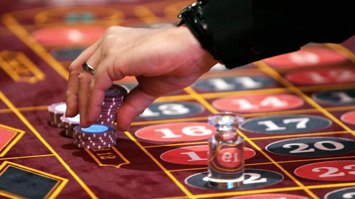 Roulette table with a hand placing bets in Pennsylvania casino